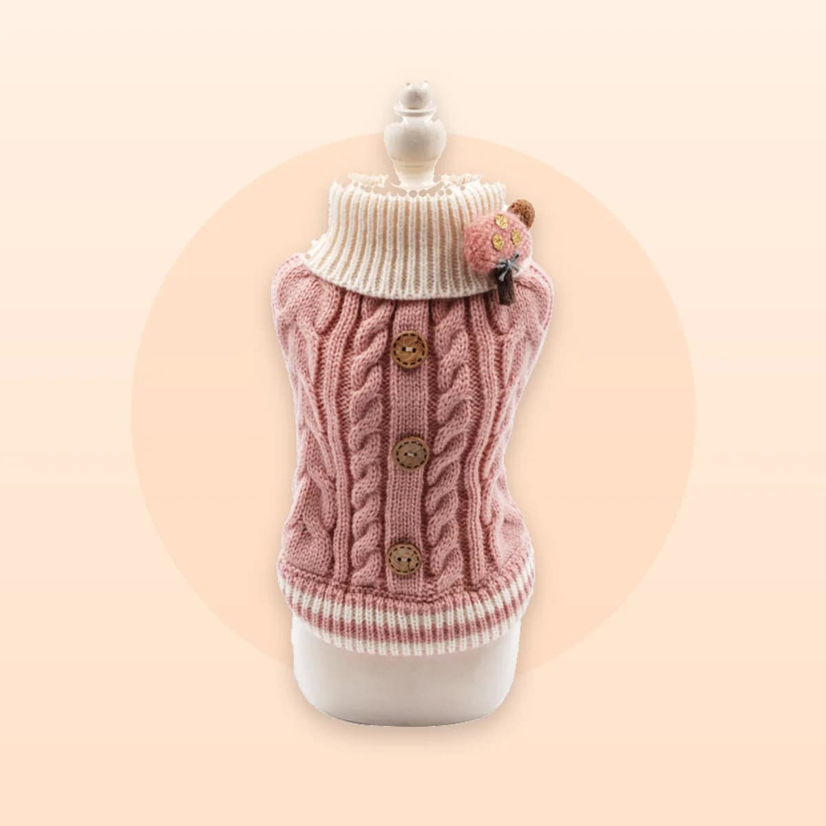 Kindral pink knit sweater shown on a mannequin