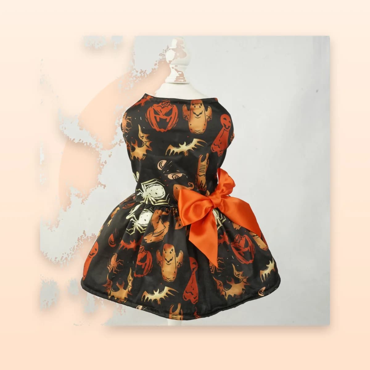 Kindral pumpkin print dress on a display form