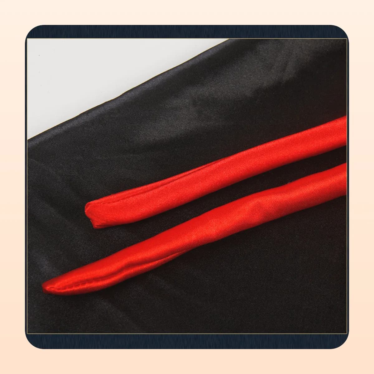 Close view of the black satin and red trim on the Kindral vampire cape