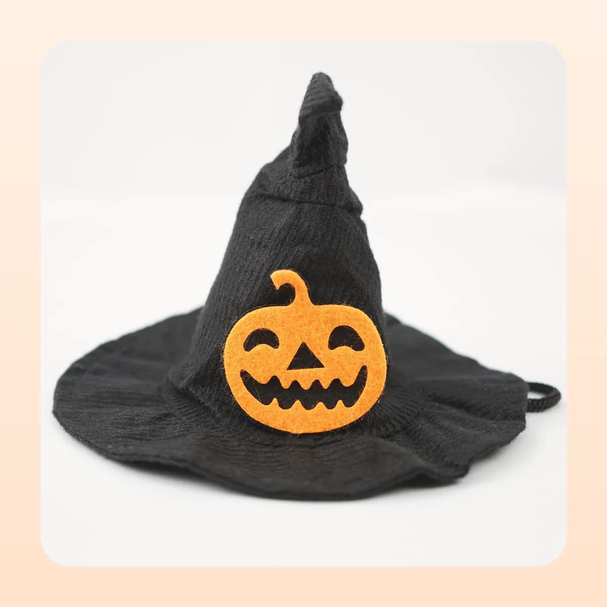 Kindral pointed witch hat with the small pumpkin appliqué