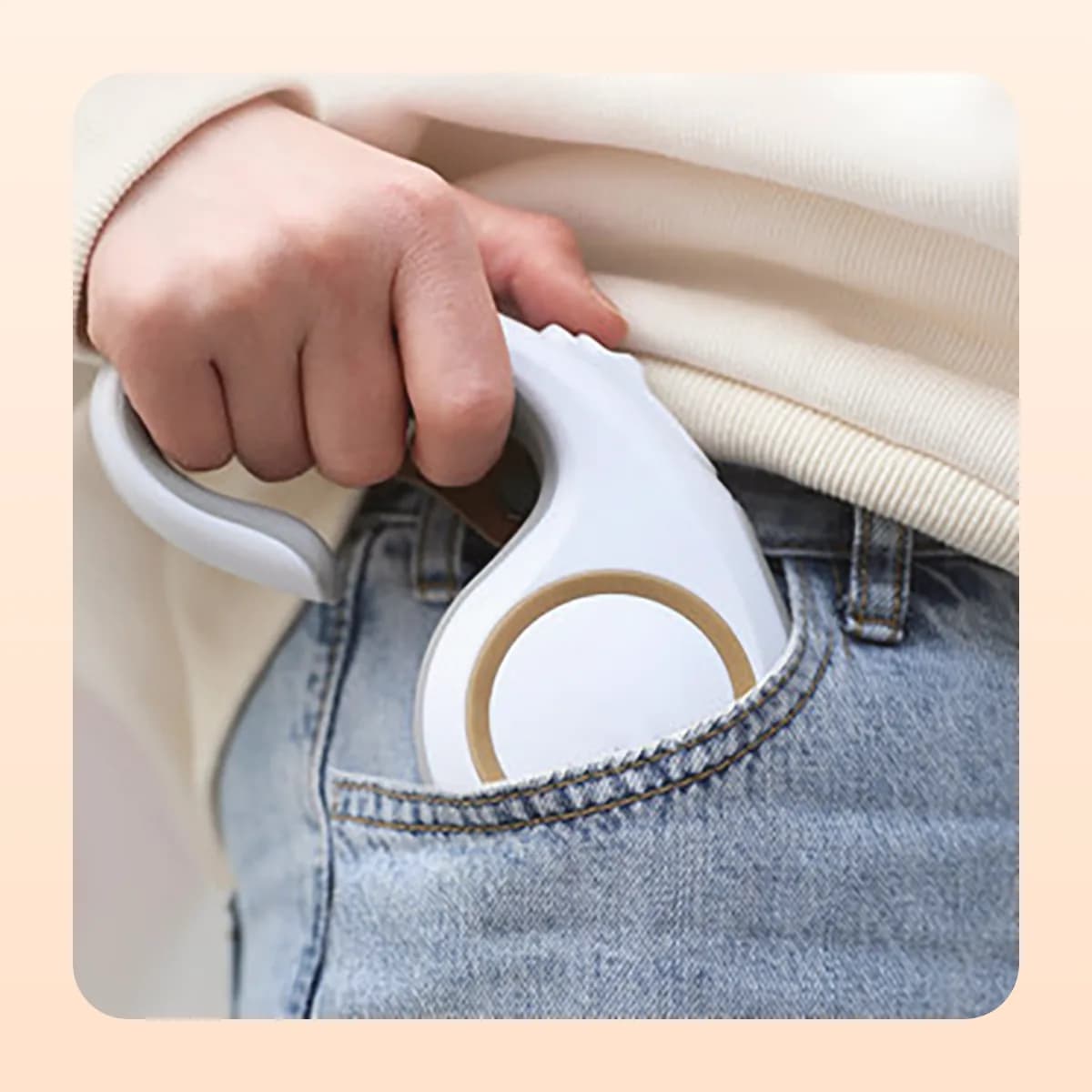 The Kindral retractable lead clipped to a belt loop