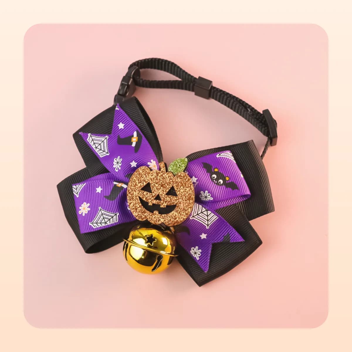 Kindral pumpkin bow tie in the web print with a gold bell